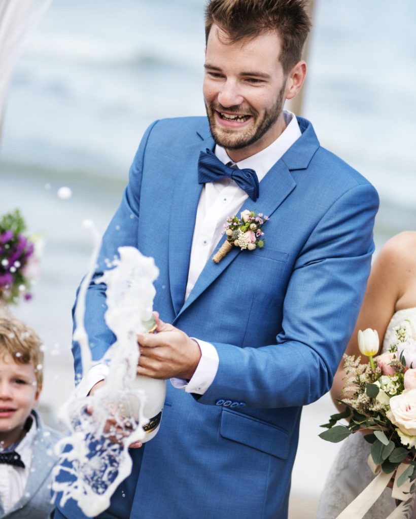 young-couple-in-a-wedding-ceremony-at-the-beach-e1630316228823.jpg